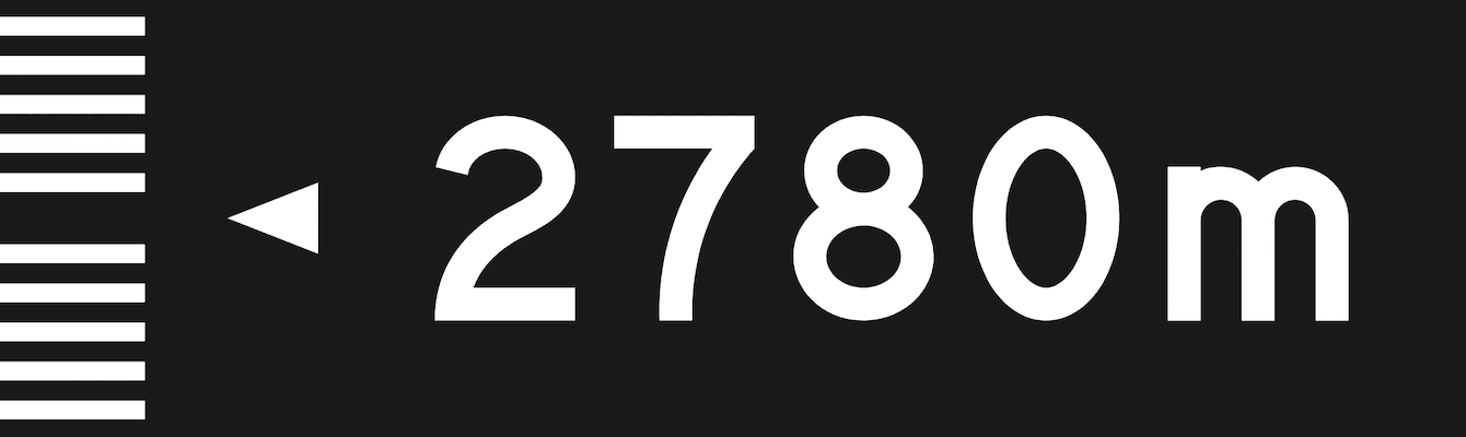 The proposed design: white legend on a black panel reading “◄ 2780m”, with a white ladder-striped bar down the left edge.